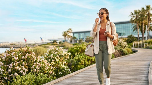 Young traveler using oral dissolving strip outdoors during spring travel for easy on-the-go wellness and daily routine support