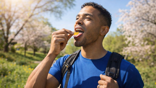 Active person outdoors in spring sunshine taking oral dissolving vitamin D strip for convenient wellness on the go