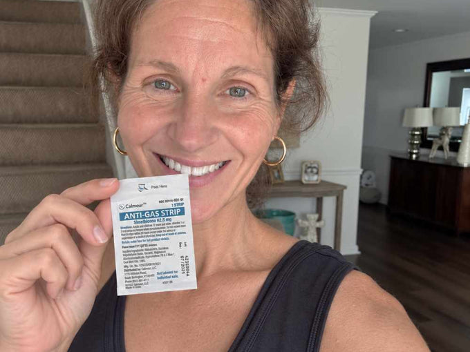 A Calmour customer holding an individually sealed anti-gas strip at home